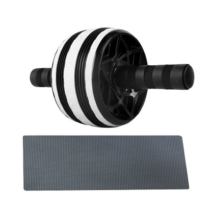 Black and white dual-wheel ab roller with foam grips and textured grey knee pad for home fitness