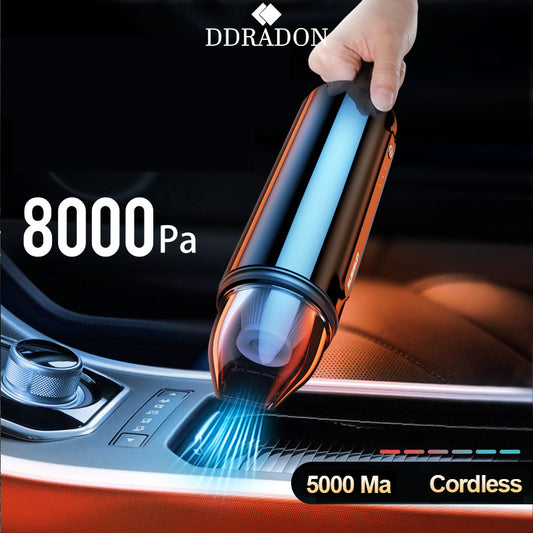 Hand using DDRADON cordless mini car vacuum cleaner with 8000Pa suction on car interior