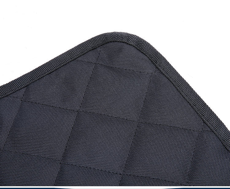 Close-up of black textured waterproof dog car seat cover with anti-skid mesh and piped edges
