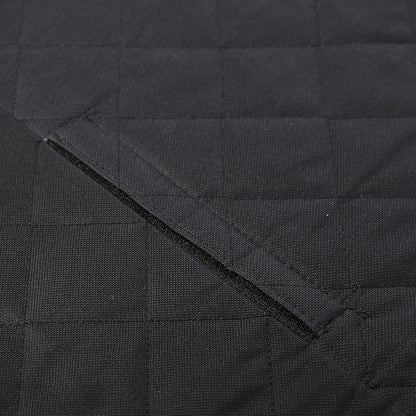 Close-up of black waterproof quilted fabric with a diagonal stitched slit or opening