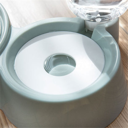 close-up of a gray automatic dog water bowl with built-in water dispenser on wooden floor