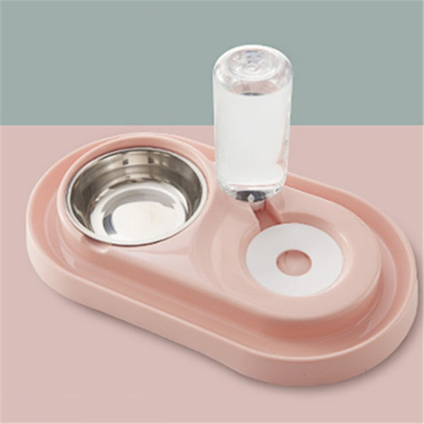 pink automatic dog bowl with stainless steel water dispenser and ball refill system on two-tone surface
