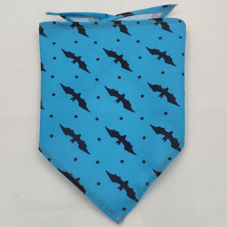 Blue dog bandana with black bat and star pattern, durable fabric for pet accessories