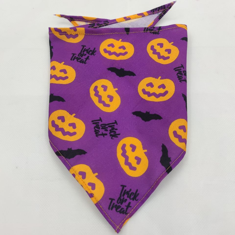 Purple Halloween dog bandana with orange jack-o'-lanterns, black bats, and "Trick or Treat" text