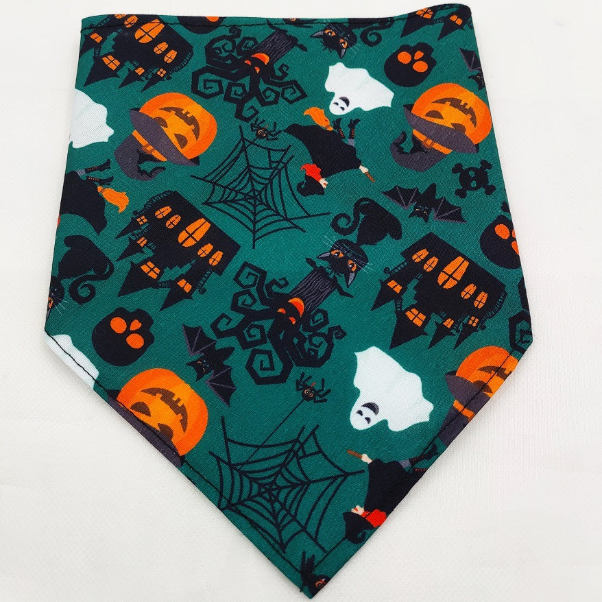 green Halloween dog bandana with pumpkins, ghosts, black cats, haunted houses, spiderwebs, and bats
