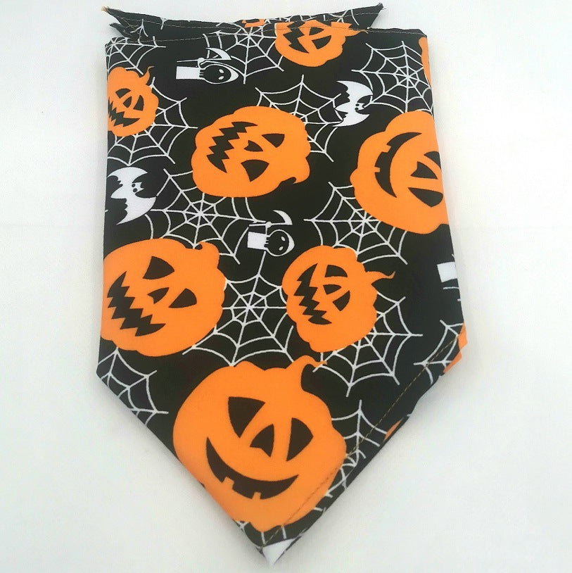 Black dog bandana with orange jack-o'-lanterns, white spider webs, ghosts, and bats Halloween print