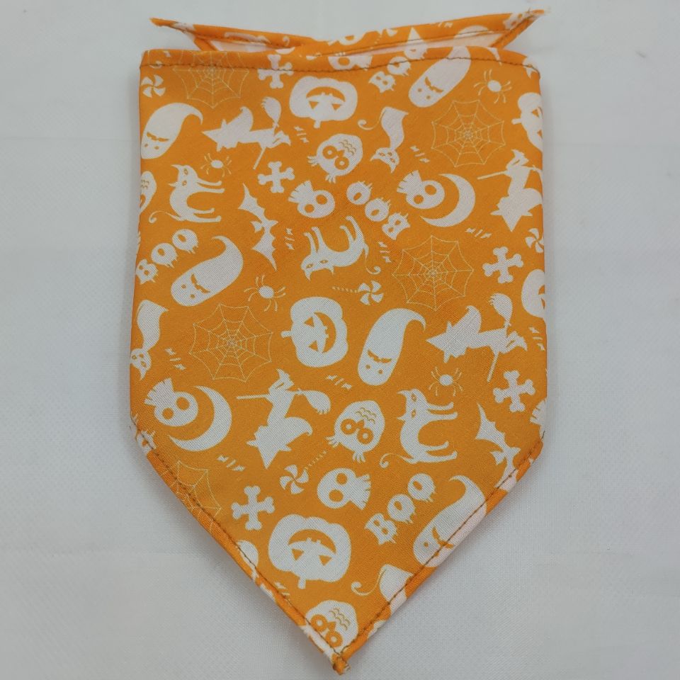 Orange Halloween-themed dog bandana with white ghosts, pumpkins, spiders, and bats
