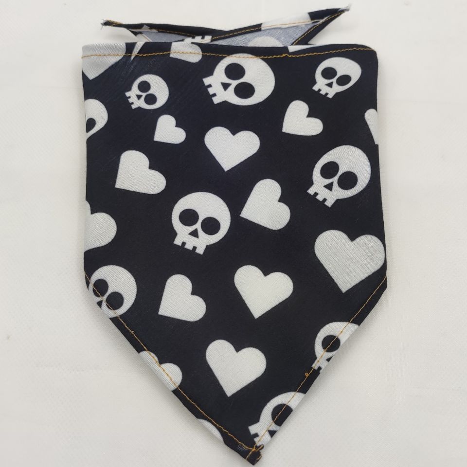 Black dog bandana with white skull and heart pattern, durable polyester fabric