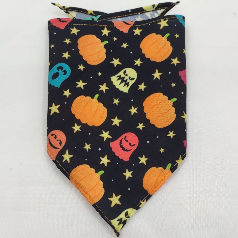 Halloween dog bandana with orange pumpkins and colorful ghosts on black fabric