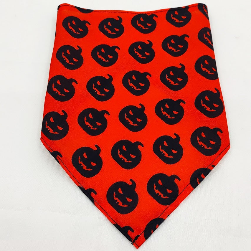 Orange dog bandana with black jack-o'-lantern pumpkin pattern for Halloween