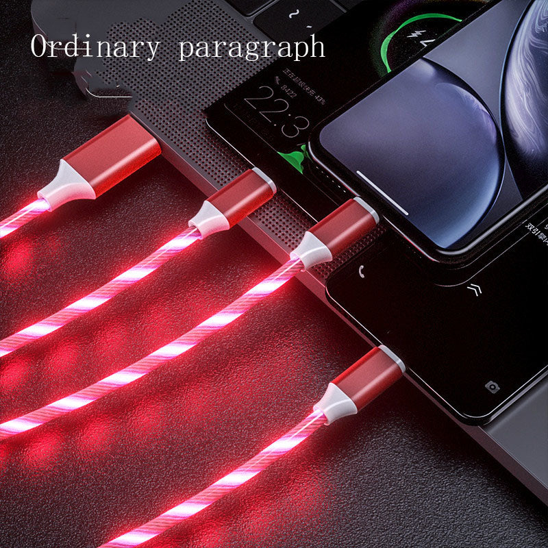 Red LED glowing 3-in-1 USB charging cables connected to multiple smartphones on a laptop