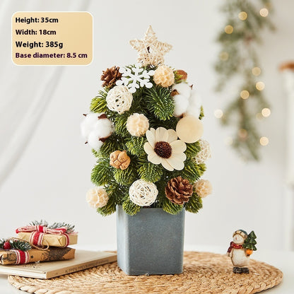 Small Christmas tree decoration with pine cones, cotton, white ornaments in gray pot on woven placemat