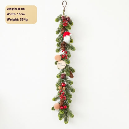 Christmas garland wreath with pine cones, red berries, Santa decoration, and Merry Christmas tag