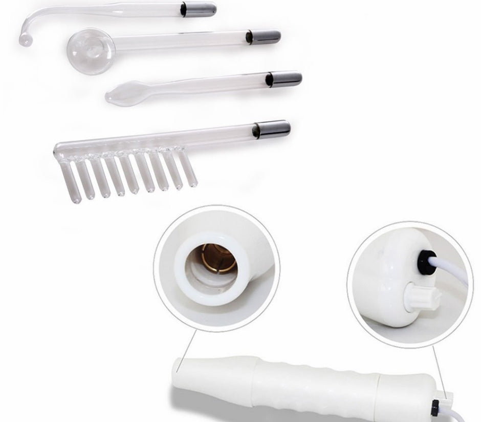 High frequency skin therapy wand with four glass electrode attachments for acne treatment on white background