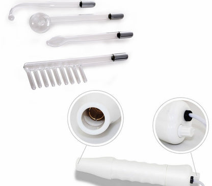 High frequency skin therapy wand with four glass electrode attachments for acne treatment on white background