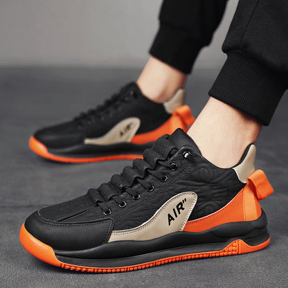 Men's black and beige sport sneakers with orange sole and heel pull tab, branded 'AIR'