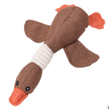 Beige plush duck dog toy with orange beak and tail, durable squeaky interactive pet toy