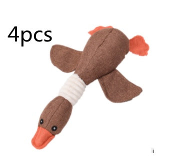 Beige plush duck dog toy with squeaky orange beak and tail, durable interactive pet playtime