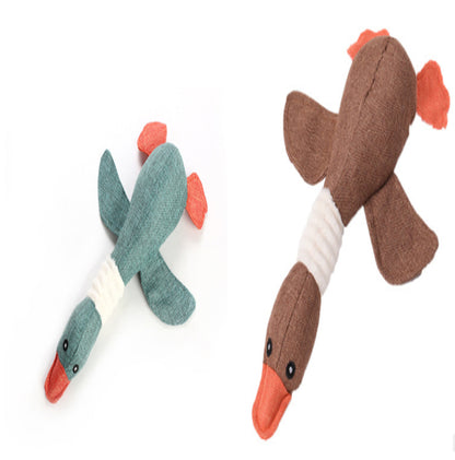 Two plush duck dog toys in teal and brown with orange beaks and tails on white background