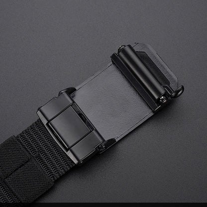 Close-up of black automatic buckle on durable canvas belt against dark background