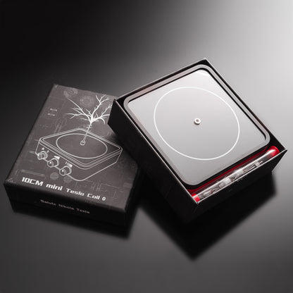 10cm mini Tesla coil physics toy in black packaging with illustration and accessories on black surface