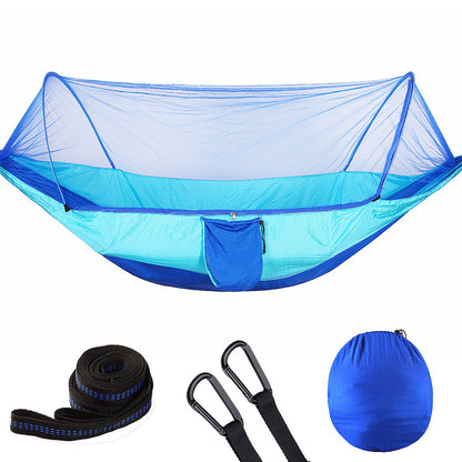 Blue camping hammock with mosquito net, straps, carabiners, and carrying pouch