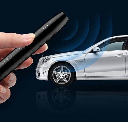 Hand holding black Trendoligy spy detector near white luxury car with signal waves
