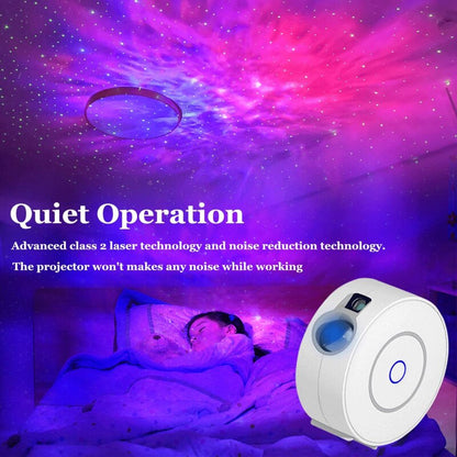 White starry sky projector lamp casting purple and pink stars in bedroom with sleeping child