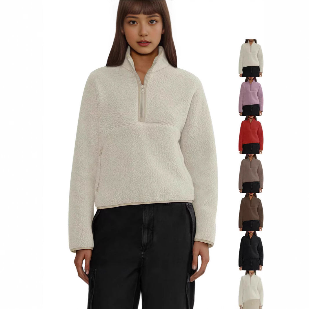 Woman wearing Trendoligy women's white half-zip loose lamb wool sweatshirt with black pants