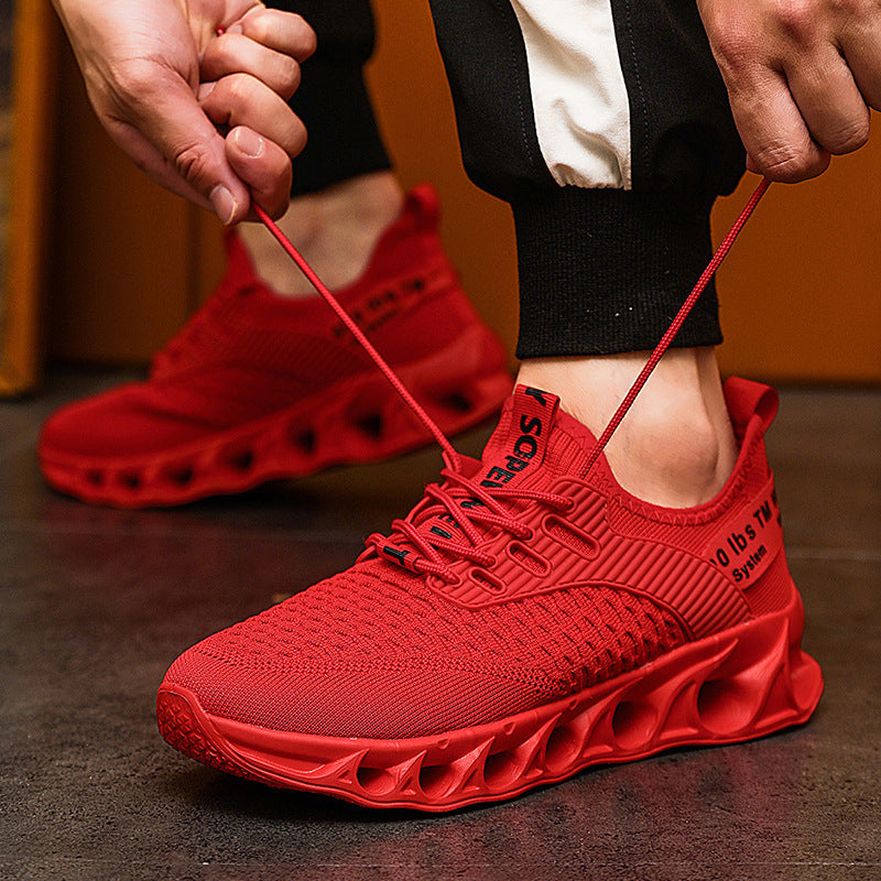 red men's breathable mesh running shoes with unique ventilated sole, laced up on black pants