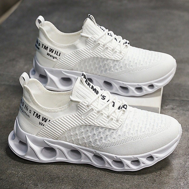 White breathable mesh athletic running shoes with unique hollow sole design on gray floor