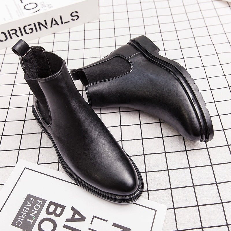 Black men's leather Chelsea boots with pointed toe on checkered surface and background text