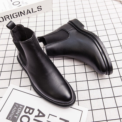 Black men's leather Chelsea boots with pointed toe on checkered surface and background text