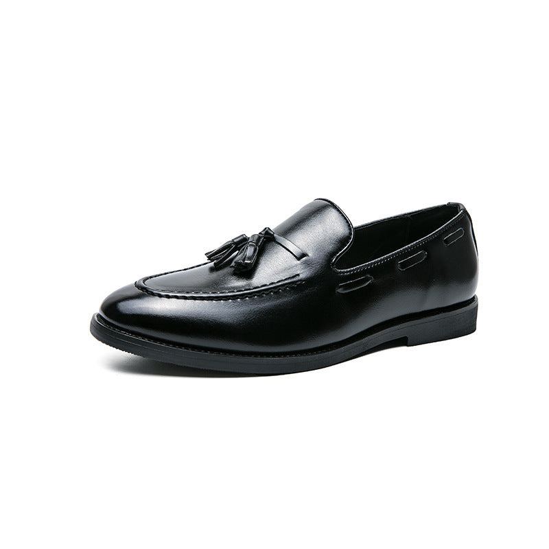Black tassel slip-on men's dress loafer in shiny leather with stitched detailing