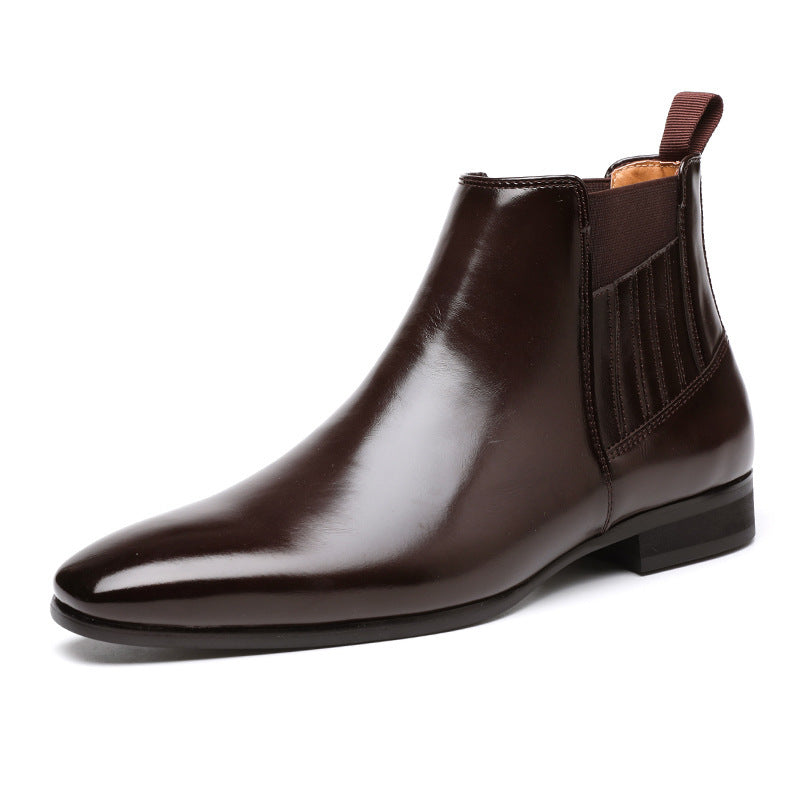 Men's dark brown leather Chelsea boot with pointed toe and elastic side panels on white background
