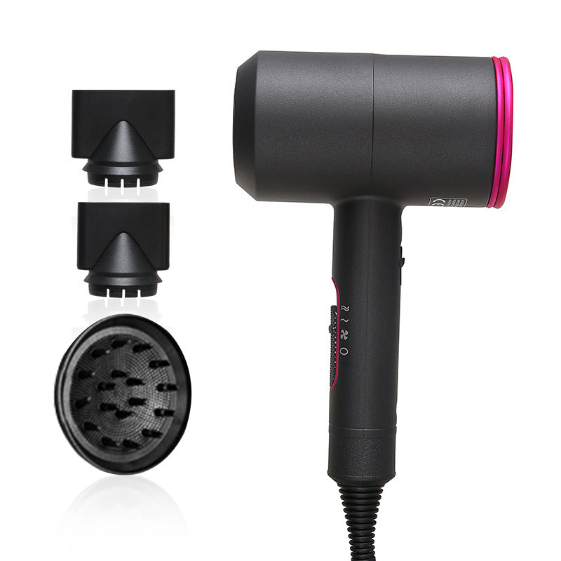 Black handheld hair dryer with pink ring and three black attachment accessories on white background