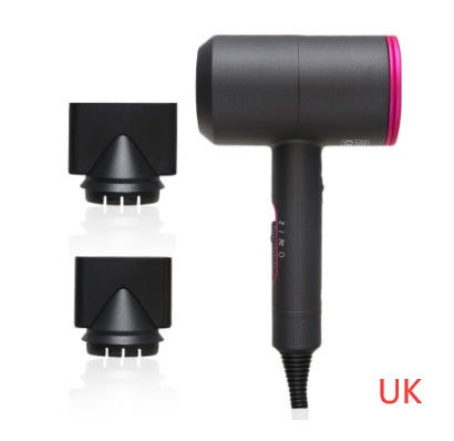 Black hotel hair dryer with pink trim and two black concentrator nozzles on white background