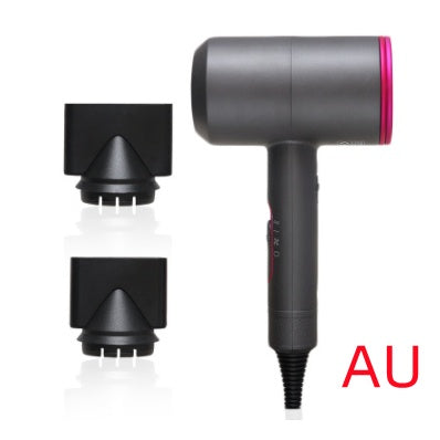 Black and pink hotel hair dryer with two black nozzle attachments on white background