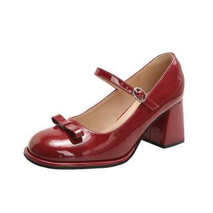 Red patent leather women's Mary Jane shoe with chunky heel and bow detail