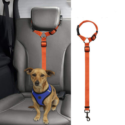 Orange adjustable dog safety seat belt leash attached to car headrest with small dog wearing blue harness