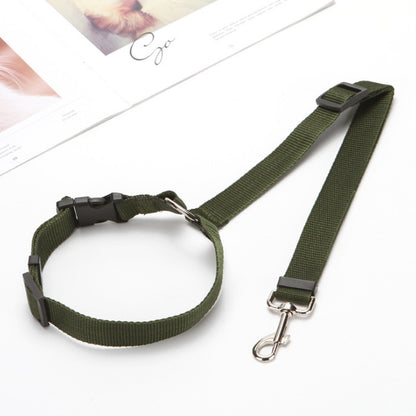 Adjustable black car pet leash with durable green polyester strap and metal clasp on white surface