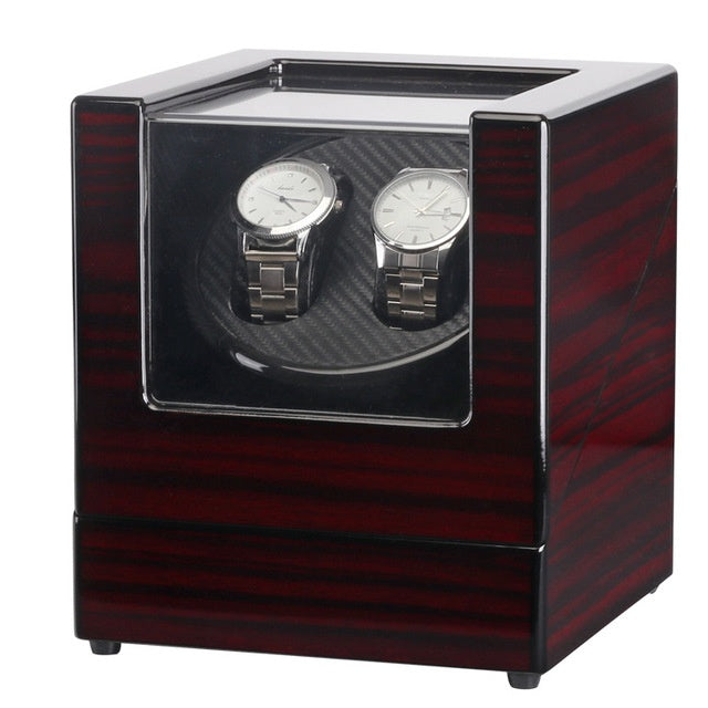 Elegant black single head watch winder with transparent front, housing two silver automatic watches