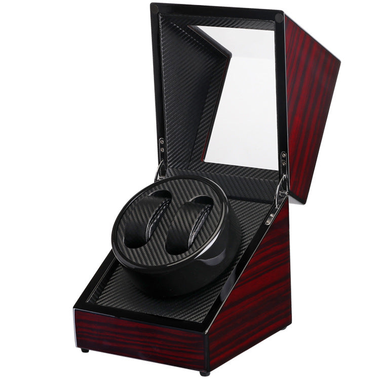 Black single head watch winder with carbon fiber interior and glossy red wood case, open lid