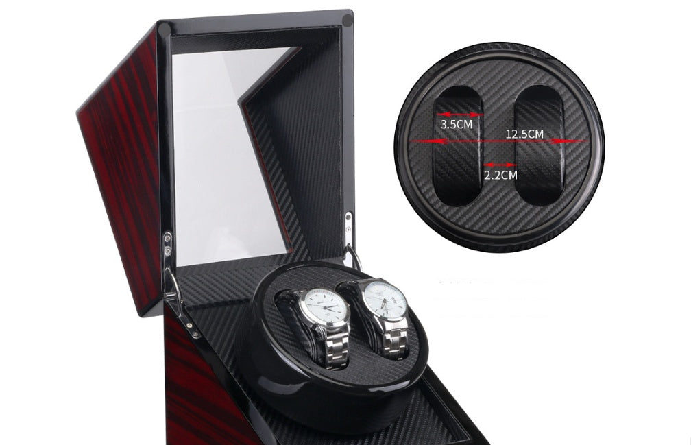 black wooden watch winder with glass lid and two silver watches inside, carbon fiber interior, size measurements