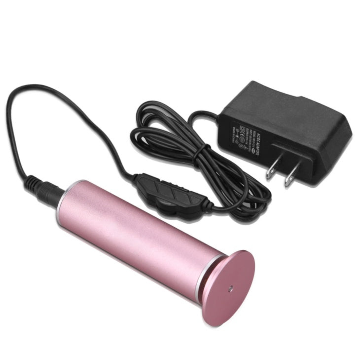 Pink cylindrical rechargeable electric callus remover pedicure tool with black power adapter and cord