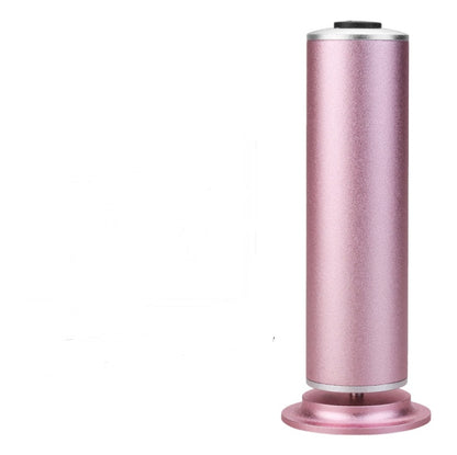 Pink rechargeable electric callus remover foot pedicure tool with stand on white background