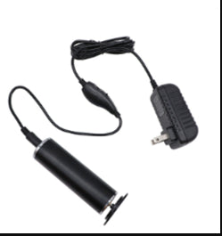 Black rechargeable electric callus remover with power adapter charger on white background