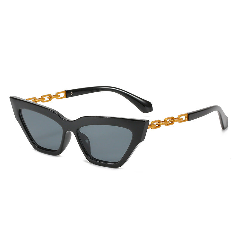 Black cat eye sunglasses with grey lenses and gold chain temple accents