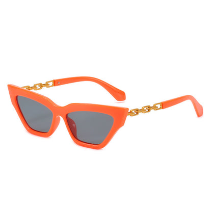Orange cat eye sunglasses with dark lenses and gold chain detail on the arms