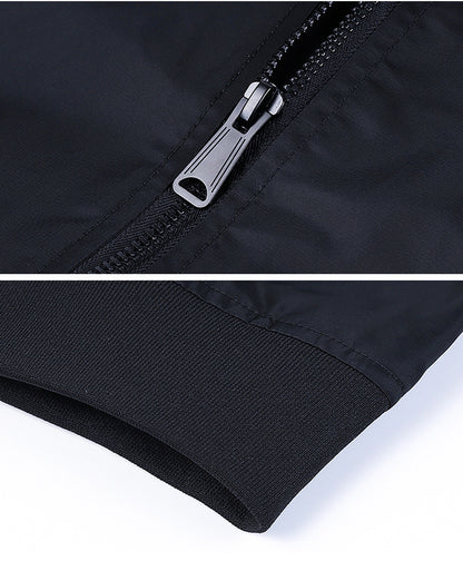 Close-up of a black men's bomber jacket sleeve with ribbed cuff and metal zipper detail